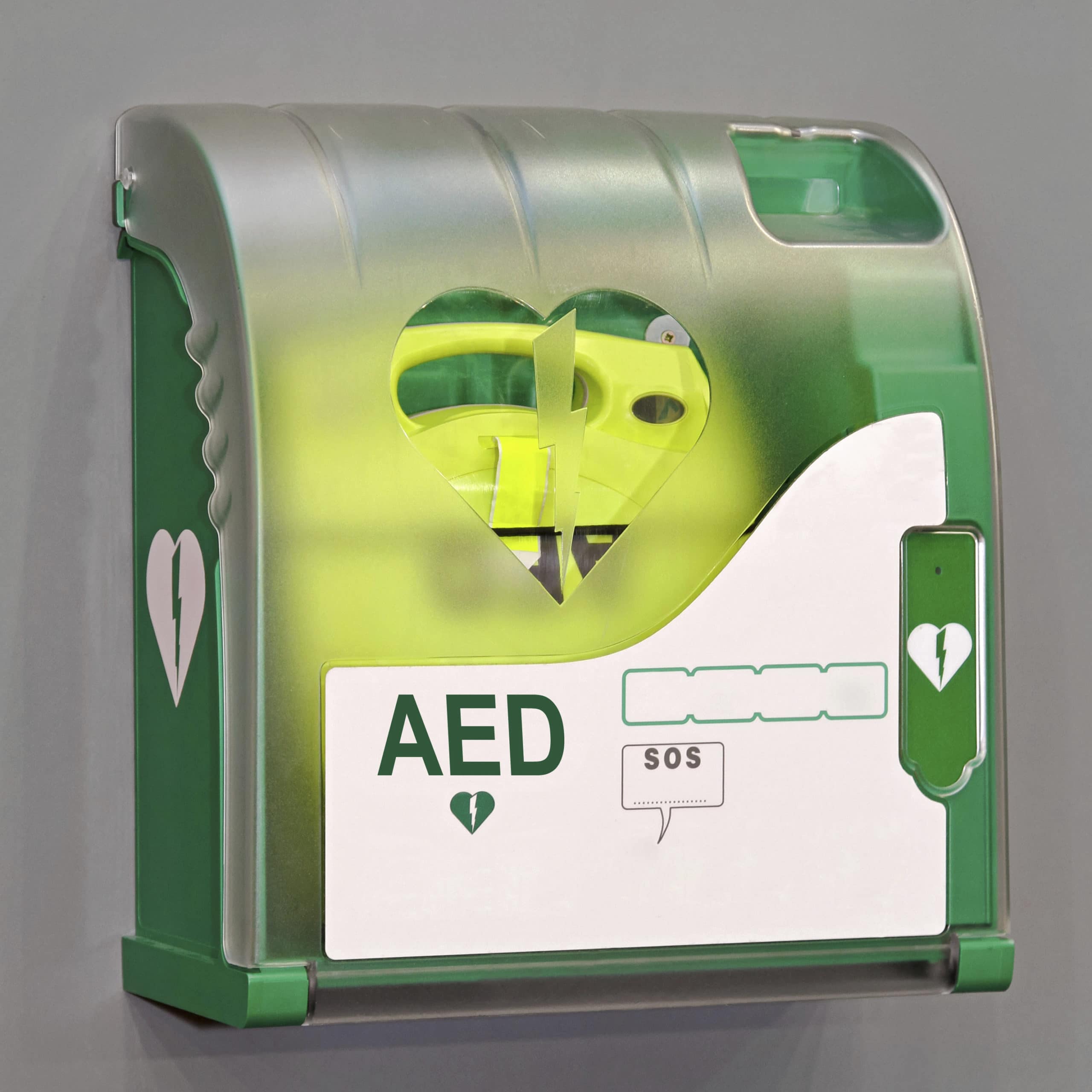An automated external defibrillator mounted in a public cabinet